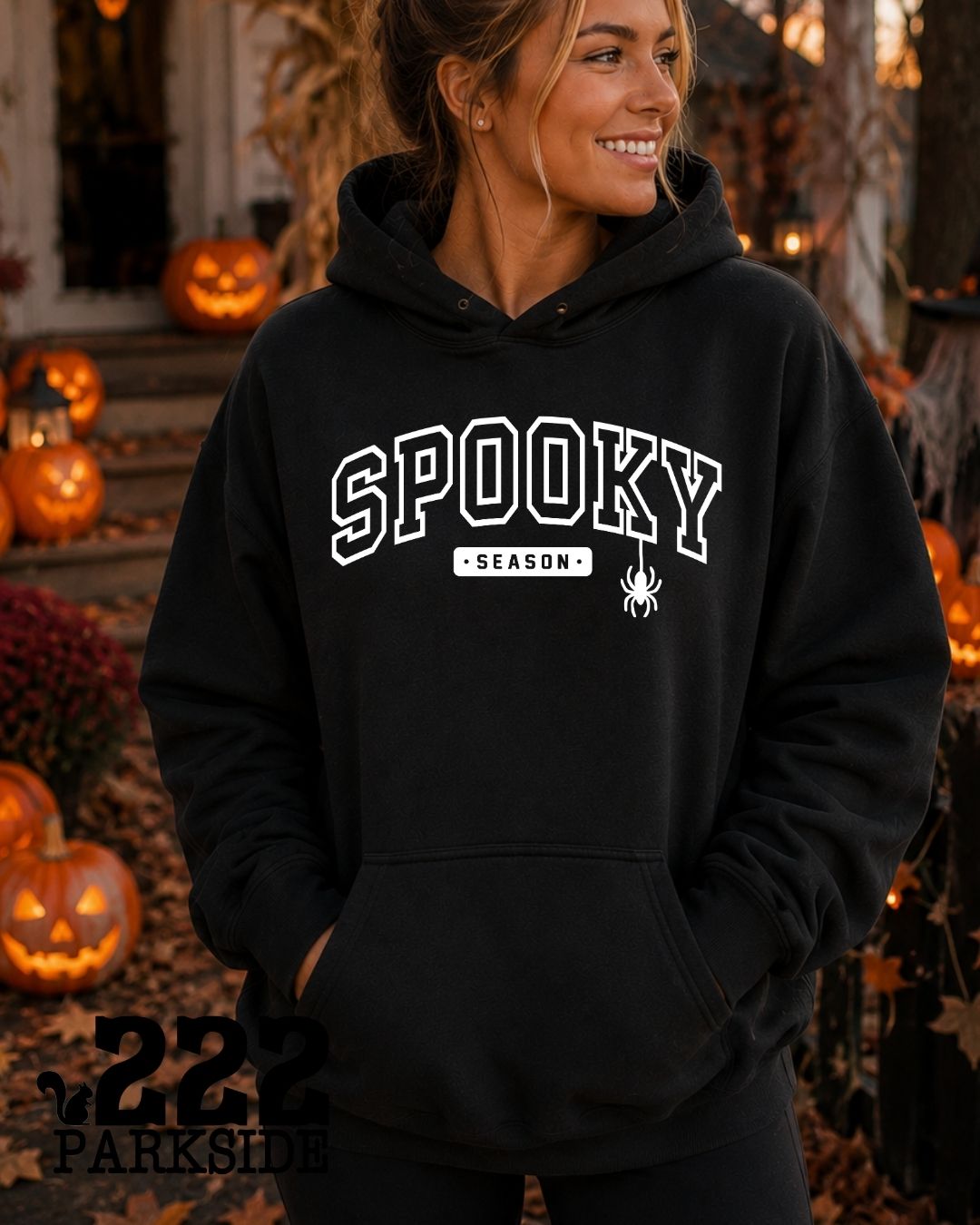 Spooky Season varsity hoodie worn at a Halloween pumpkin display