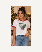 Lifestyle model wearing Christmas movies ringer tee in cozy Christmas living room