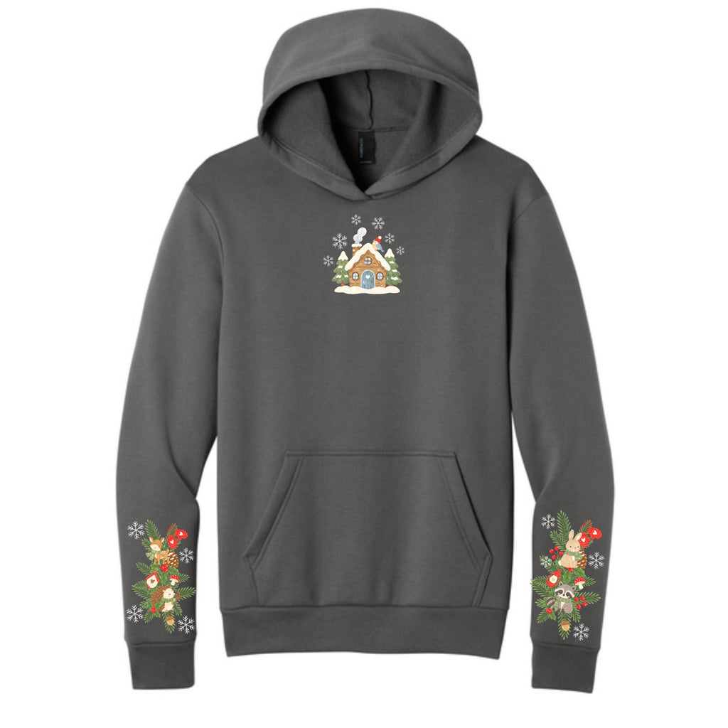 Charcoal winter cottage Christmas hoodie front and festive woodland sleeves