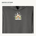 Charcoal hoodie small centered snowy cottage graphic close-up