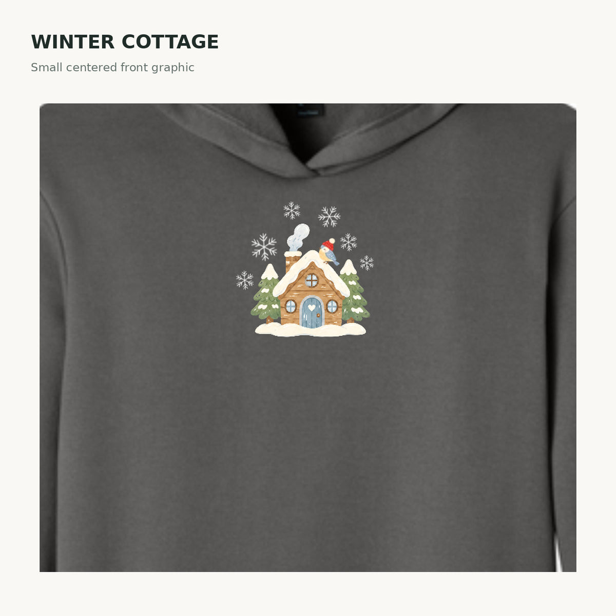 Charcoal hoodie small centered snowy cottage graphic close-up