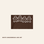 Close-up of white gingerbread line art on dark chocolate Gildan 18000 sweatshirt