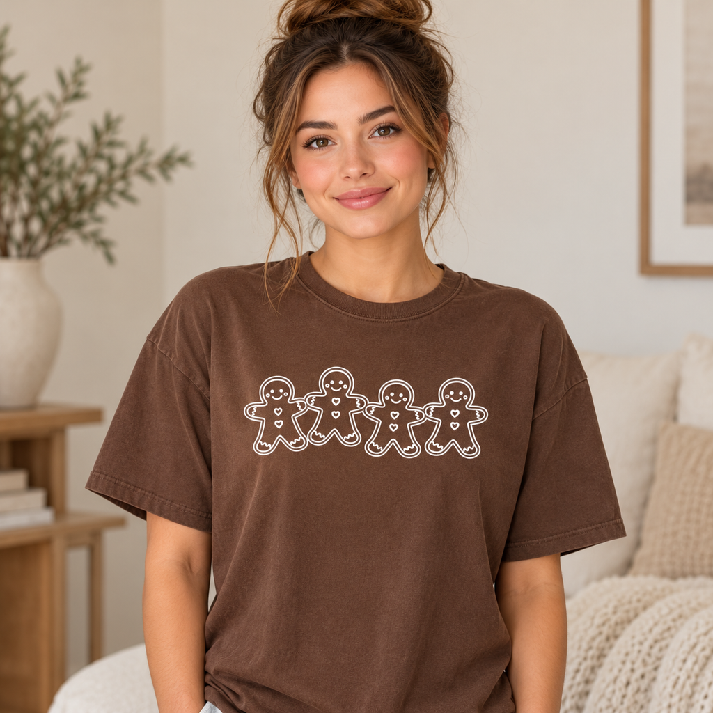 Woman wearing brown Comfort Colors gingerbread graphic tee