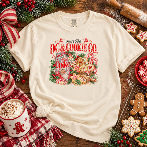 Ivory vintage North Pole Cookie Co Christmas tee in cookie baking styled holiday flat lay
