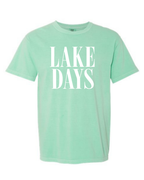 Mint green t-shirt with 'LAKE DAYS' text on a white background