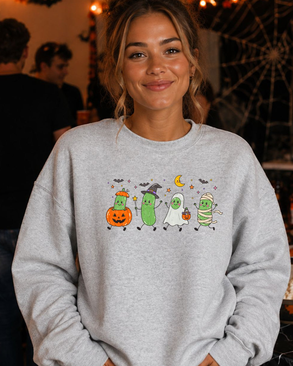 Halloween Pickles Crewneck Sweatshirt in Ash Grey featuring four pickle characters dressed as a pumpkin, witch, ghost, and mummy