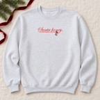 Santa Honey Ash Gildan crewneck with original artwork, flat lay